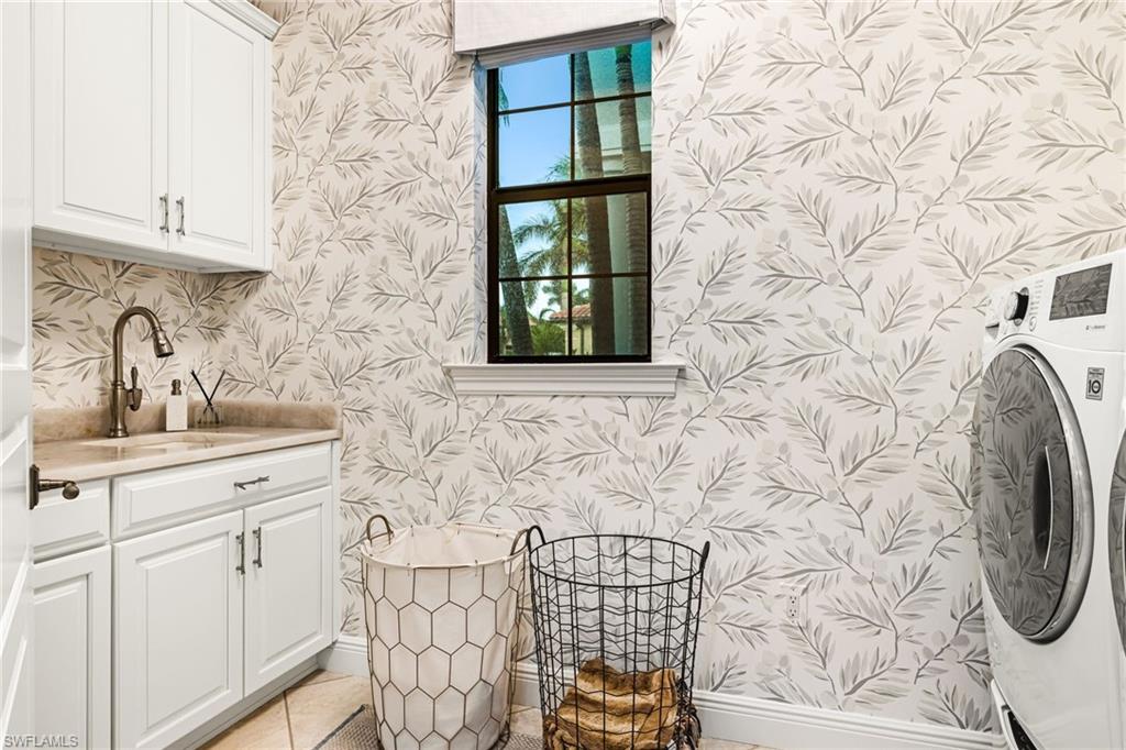 14480 Marsala Way Naples, FL 34109 - Photo 24 of 31 a bathroom with a sink and a mirror