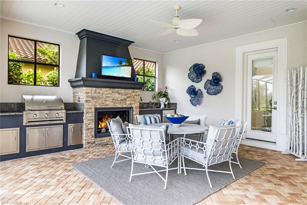 14480 Marsala Way Naples, FL 34109 - Photo 25 of 31 a dining room with furniture a fireplace and a window