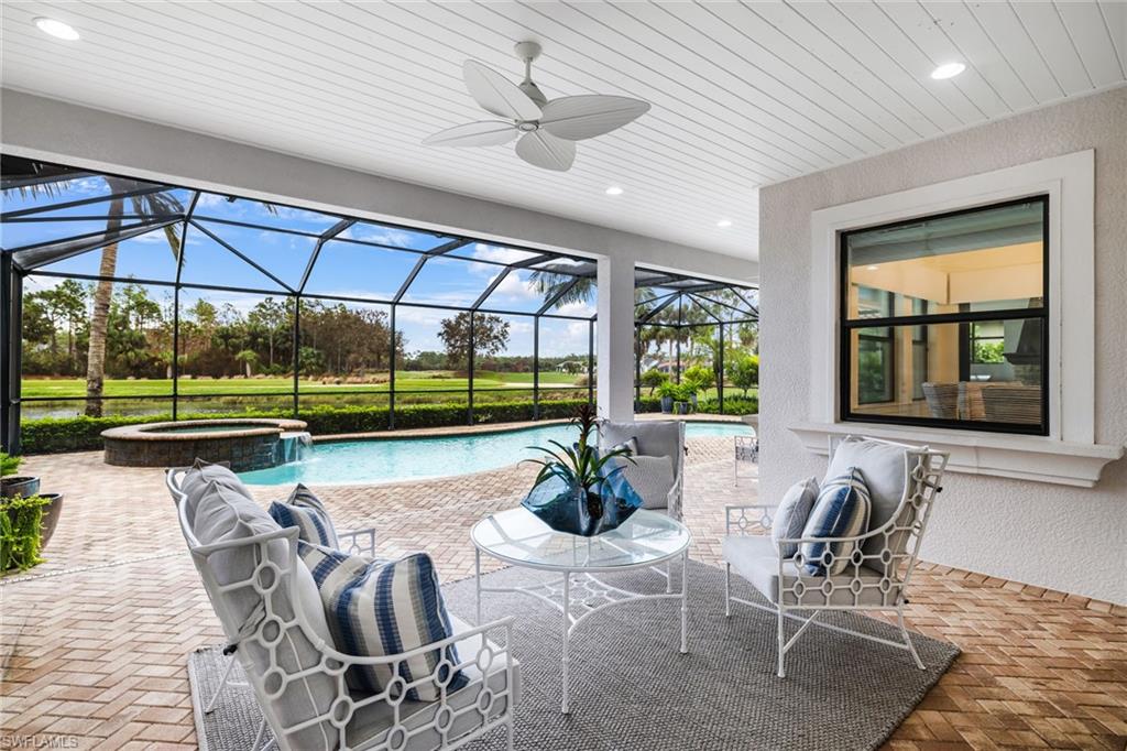 14480 Marsala Way Naples, FL 34109 - Photo 26 of 31 a dining room with furniture and a floor to ceiling window