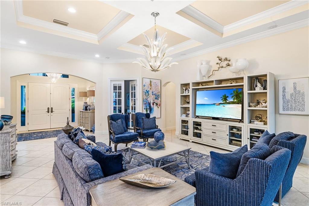 14480 Marsala Way Naples, FL 34109 - Photo 3 of 31 a living room with fireplace furniture and a flat screen tv