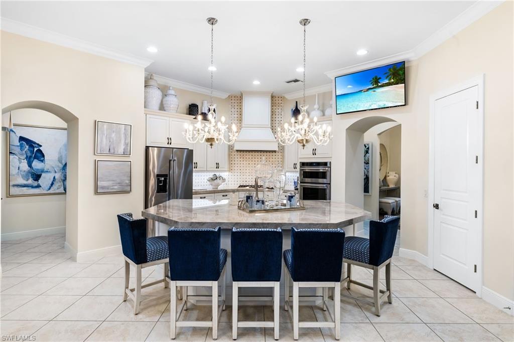 14480 Marsala Way Naples, FL 34109 - Photo 4 of 31 a view of dining table and chairs
