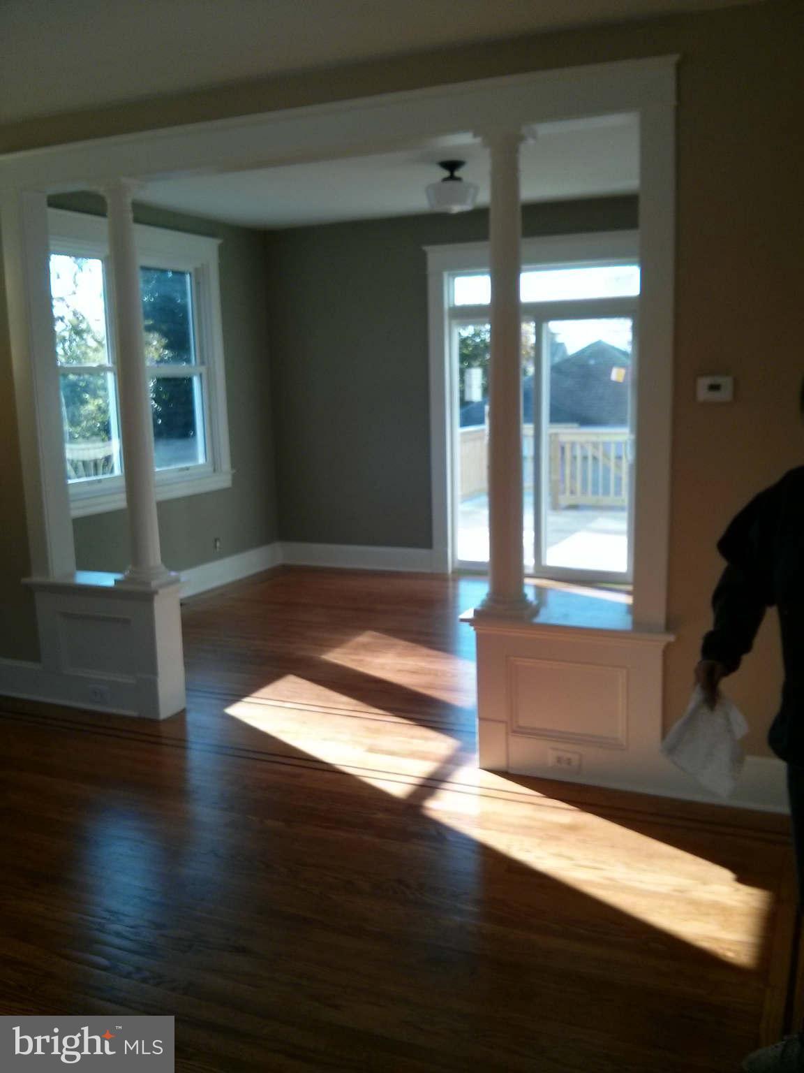 646 Orpington Road Baltimore, MD 21229 - Photo 11 of 30 a view of empty room with wooden floor and fan