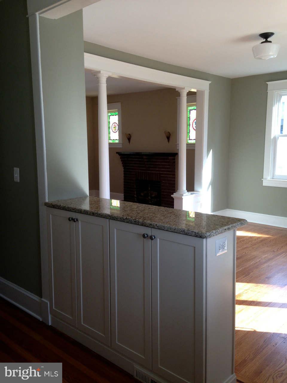 646 Orpington Road Baltimore, MD 21229 - Photo 5 of 30 a bathroom with a granite countertop sink and a mirror