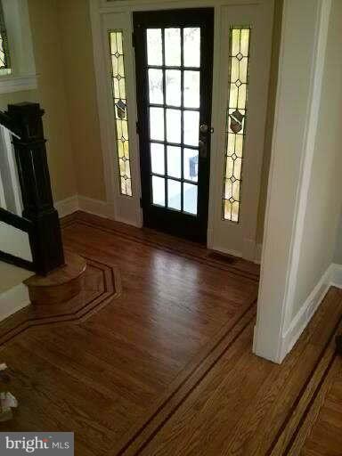 646 Orpington Road Baltimore, MD 21229 - Photo 7 of 30 a view of a room with wooden floor and a window