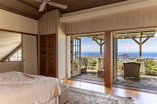 a bedroom with a bed and glass door