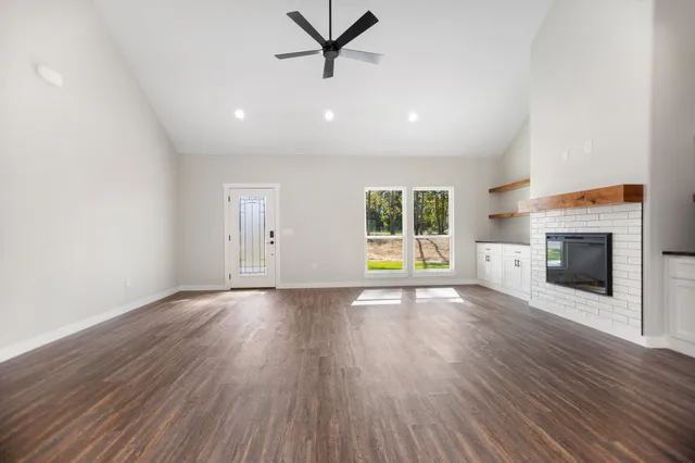 a kitchen with kitchen island a sink and a stove top oven