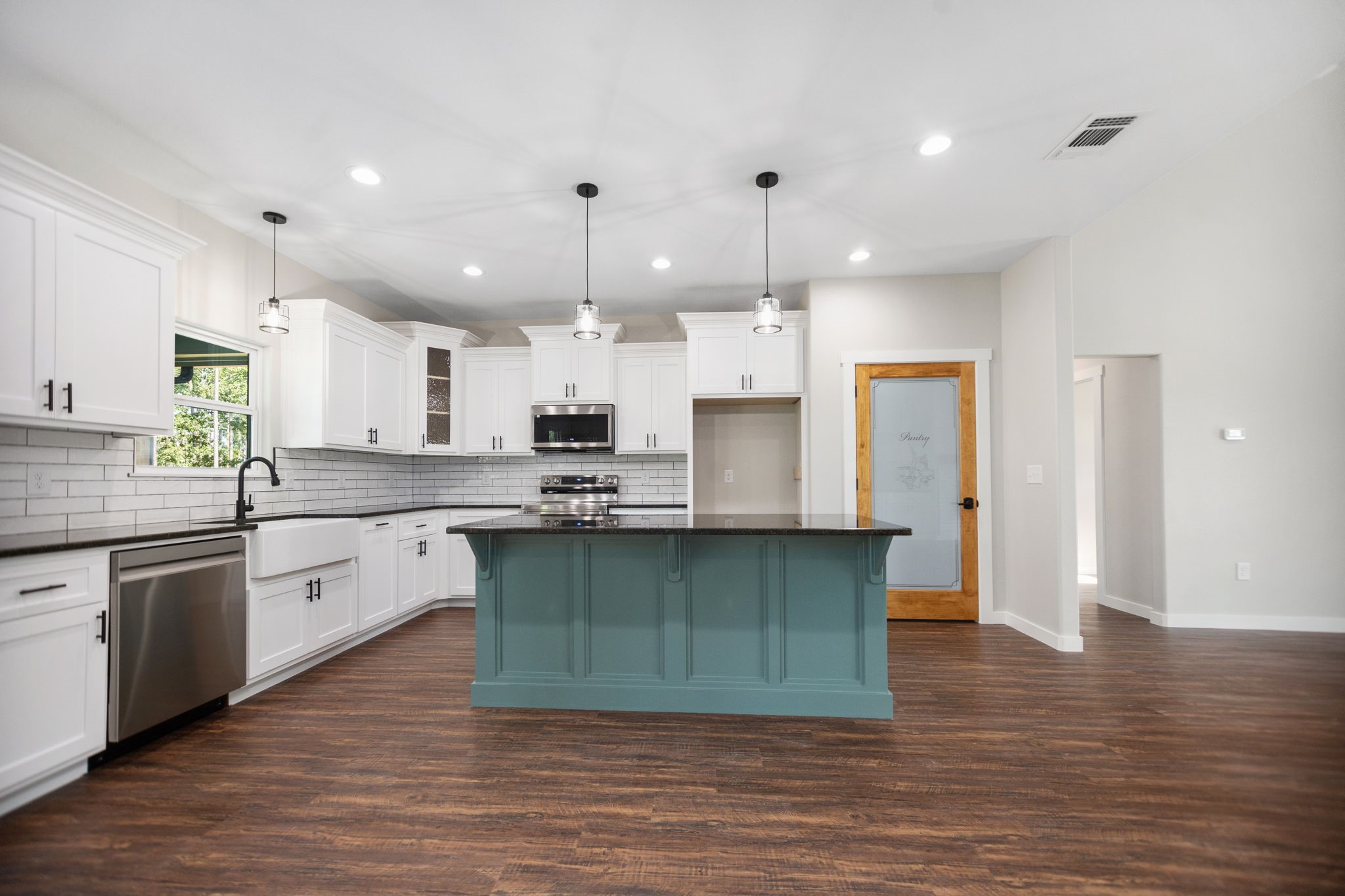 1575 Fm 844 Huntington, TX 75949 - Photo 13 of 40 a large kitchen with stainless steel appliances kitchen island granite countertop a sink and cabinets