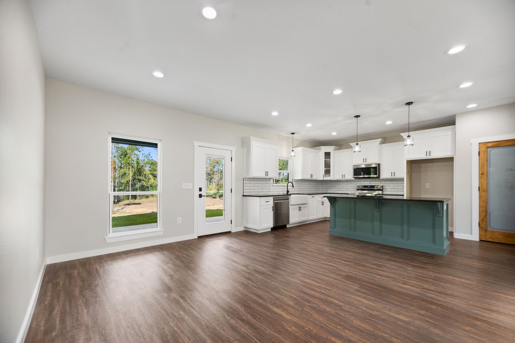 1575 Fm 844 Huntington, TX 75949 - Photo 18 of 40 a kitchen with stainless steel appliances kitchen island wooden cabinets and wooden floor