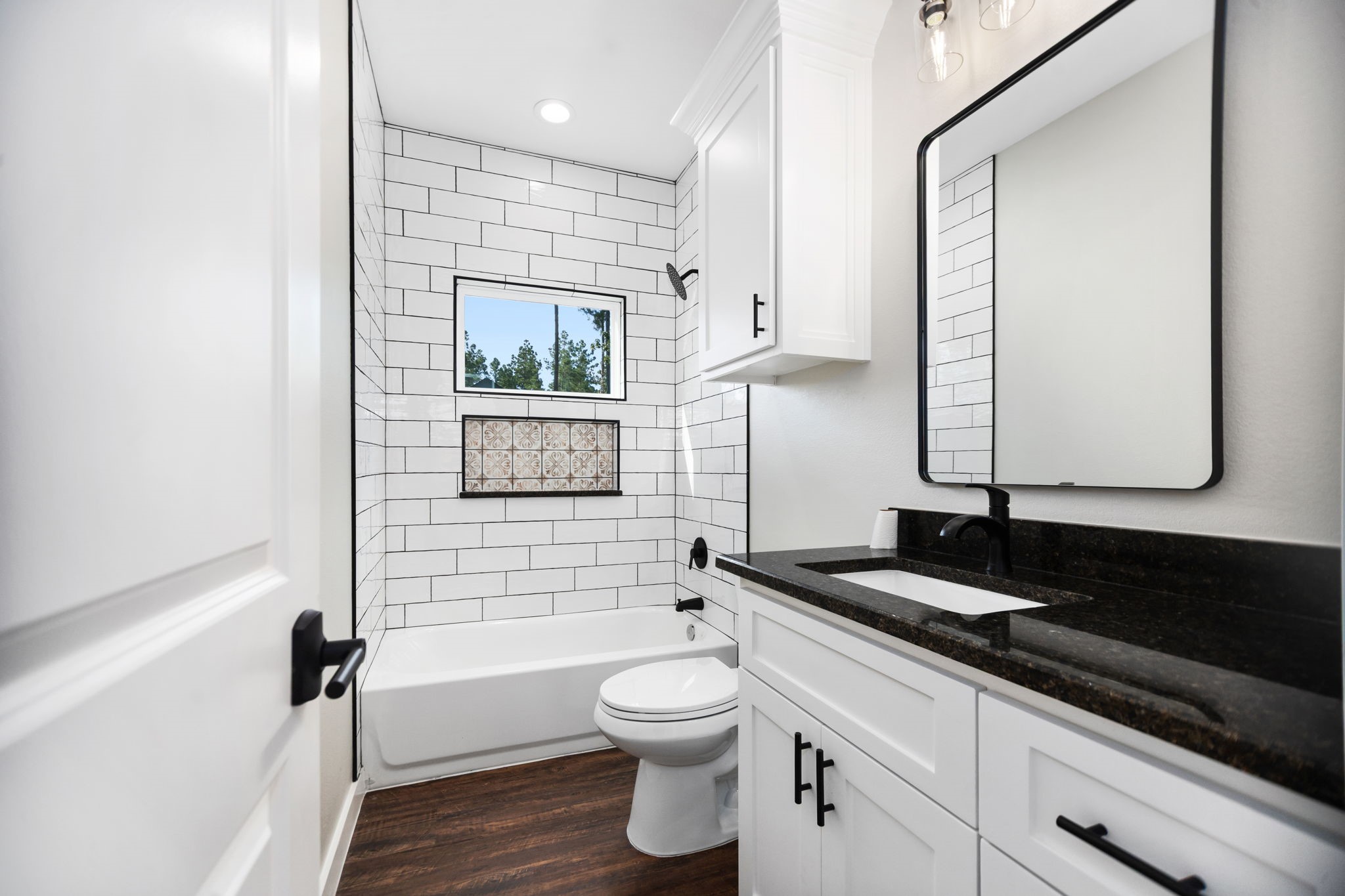 1575 Fm 844 Huntington, TX 75949 - Photo 29 of 40 a bathroom with a granite countertop sink toilet a mirror and shower