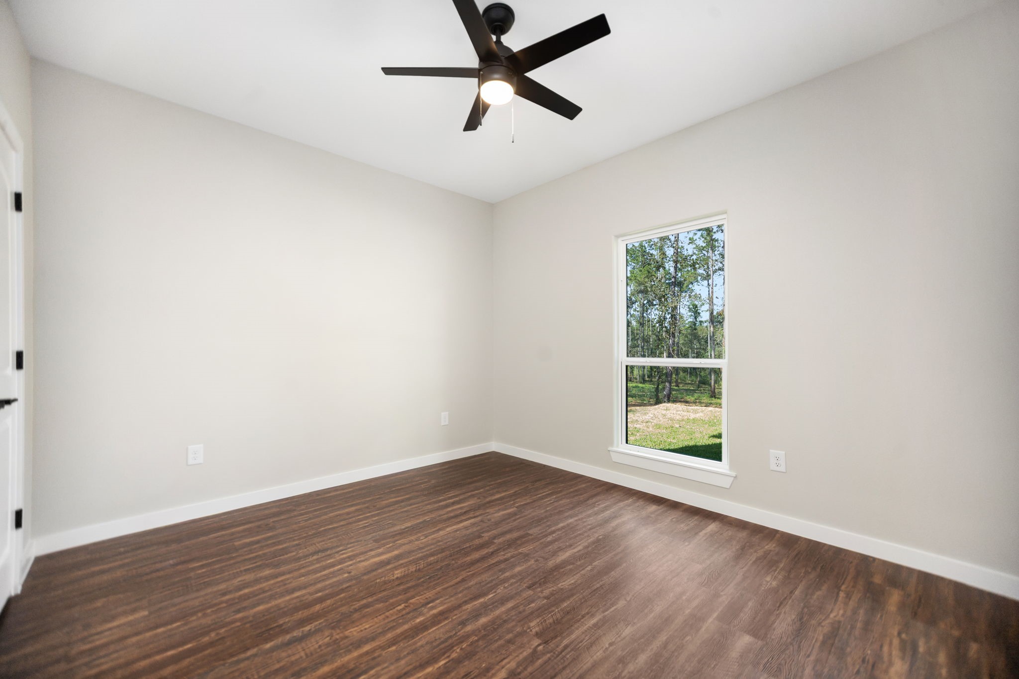 1575 Fm 844 Huntington, TX 75949 - Photo 32 of 40 wooden floor in an empty room with a window