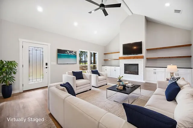 a large kitchen with stainless steel appliances kitchen island granite countertop a sink and cabinets