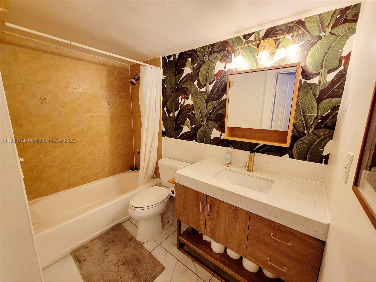 8609 Southwest 68th Court, Unit 5 Pinecrest, FL 33156 - Photo 18 of 35 a bathroom with a sink and a mirror