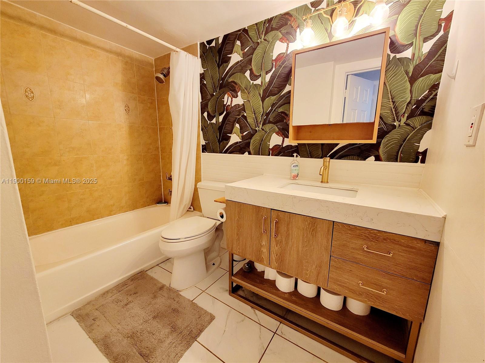 8609 Southwest 68th Court, Unit 5 Pinecrest, FL 33156 - Photo 20 of 35 a bathroom with a sink toilet and shower