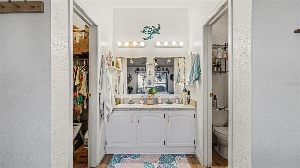 6300 East Sage Street Inverness, FL 34452 - Photo 17 of 32 a large bathroom with a sink a mirror and a shower