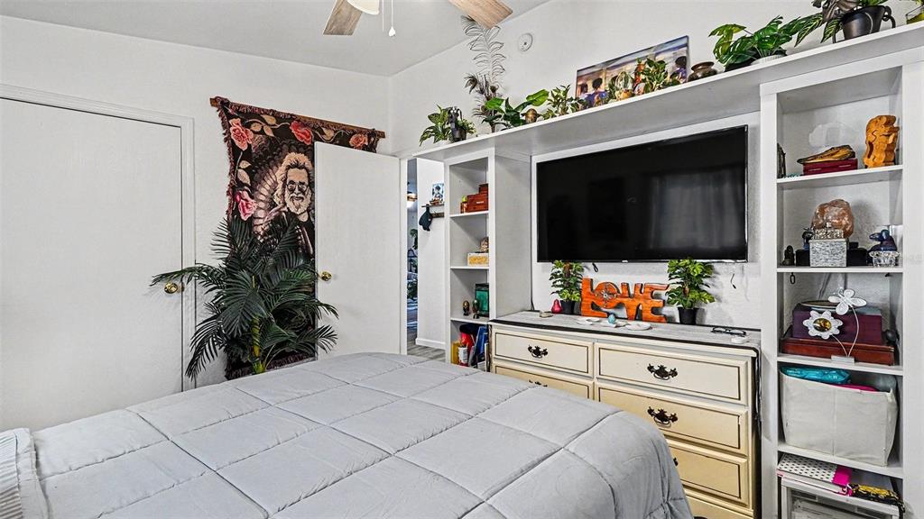 6300 East Sage Street Inverness, FL 34452 - Photo 22 of 32 a bedroom with a bed and a flat screen tv