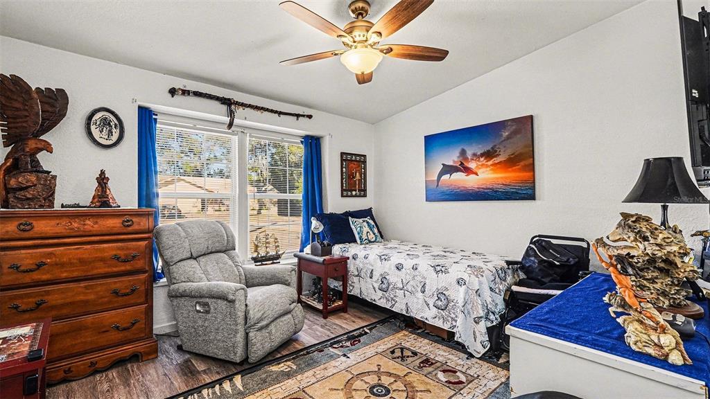 6300 East Sage Street Inverness, FL 34452 - Photo 24 of 32 a bedroom with furniture and a window