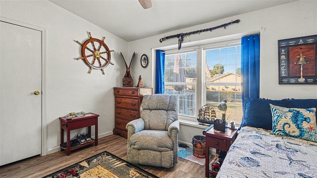 6300 East Sage Street Inverness, FL 34452 - Photo 25 of 32 a bedroom with furniture and a window