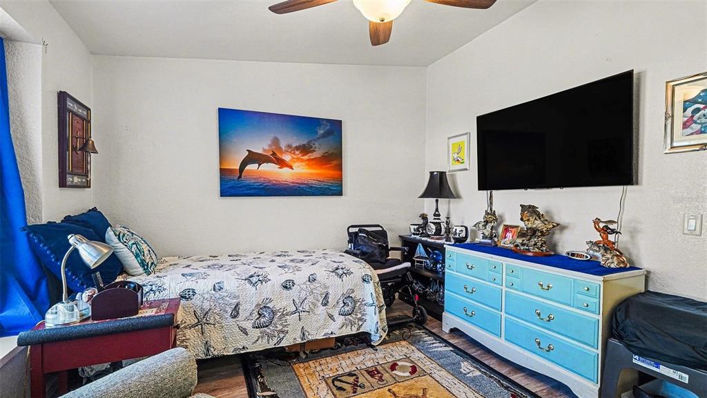 6300 East Sage Street Inverness, FL 34452 - Photo 26 of 32 a bedroom with a bed and a flat screen tv