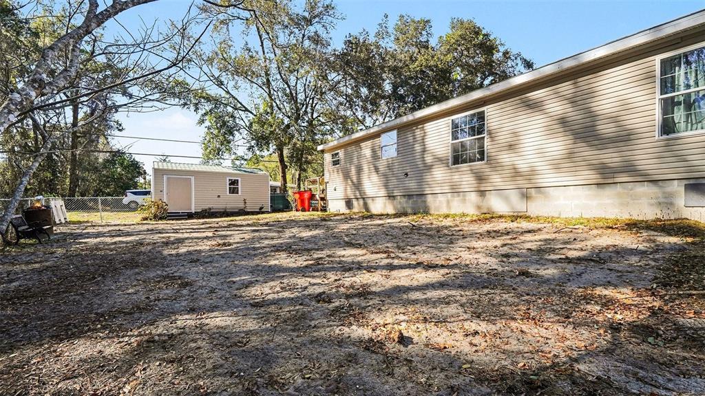 6300 East Sage Street Inverness, FL 34452 - Photo 31 of 32 a view of a house with backyard