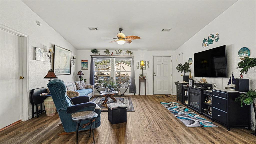 6300 East Sage Street Inverness, FL 34452 - Photo 4 of 32 a living room with furniture and a flat screen tv