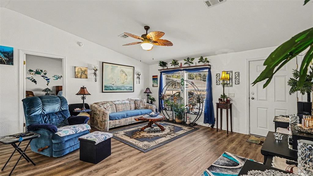 6300 East Sage Street Inverness, FL 34452 - Photo 5 of 32 a living room with furniture and a window