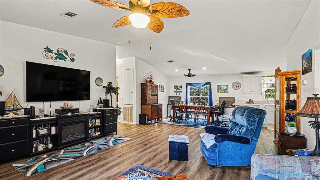 6300 East Sage Street Inverness, FL 34452 - Photo 7 of 32 a living room with furniture and a flat screen tv