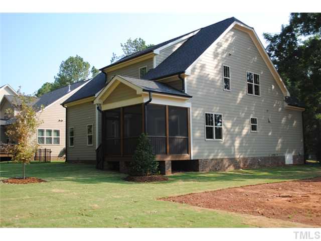 6503 Glendower Road Raleigh, NC 27613 - Photo 24 of 25 a view of a house with a yard