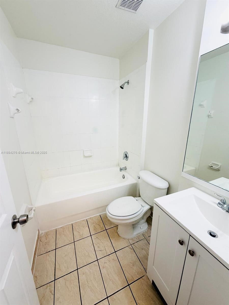 26323 Southwest 135th Place Homestead, FL 33032 - Photo 12 of 23 a bathroom with a sink a toilet and shower