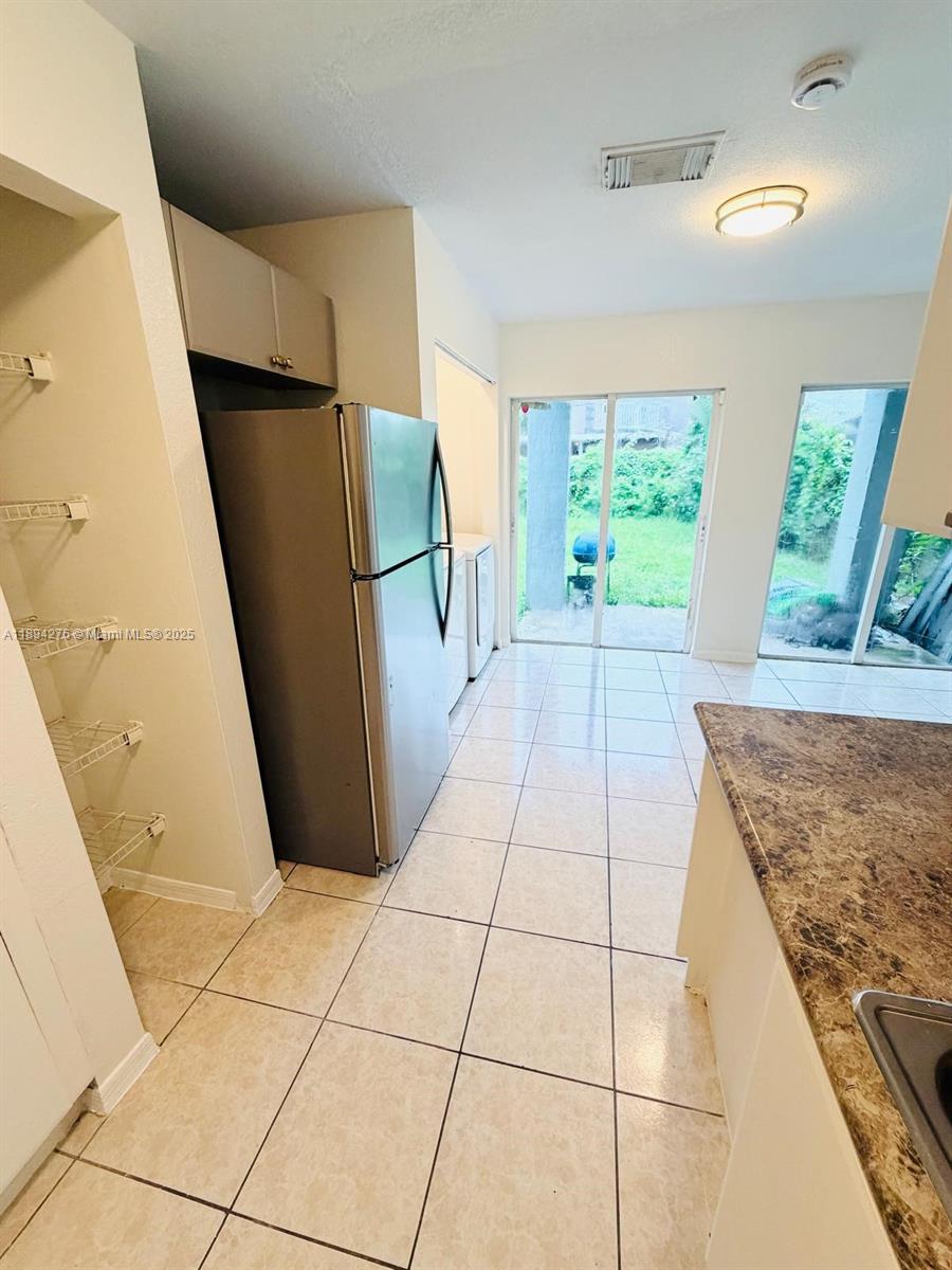 26323 Southwest 135th Place Homestead, FL 33032 - Photo 7 of 23 a view of a storage & utility room