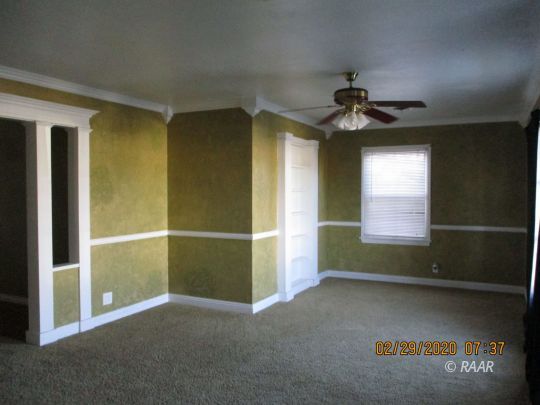 336 North Sanders Street Ridgecrest, CA 93555 - Photo 3 of 18 an empty room with windows