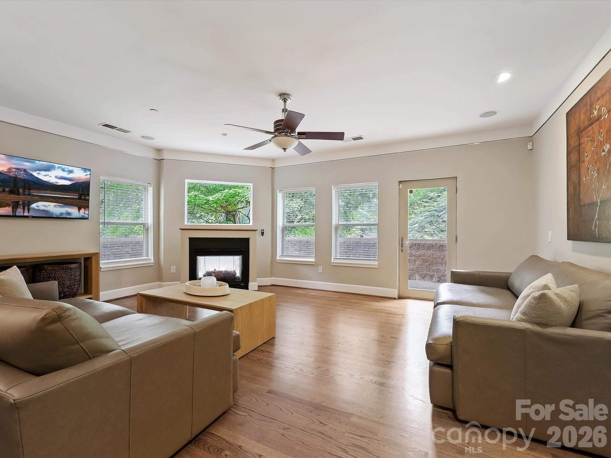420 Queens Road Charlotte, NC 28207 - Photo 11 of 35 a living room with furniture and a fireplace