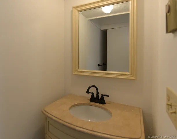 a bathroom with a sink and mirror