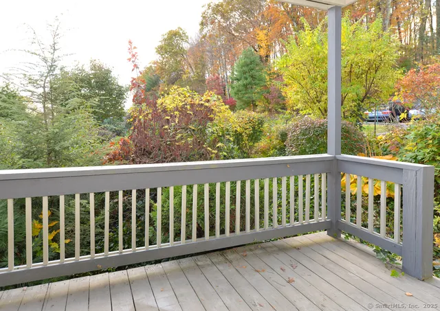 a view of balcony with wooden floor