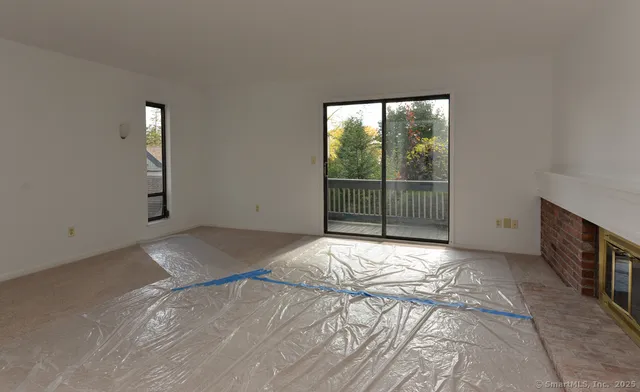 a view of an empty room with a balcony