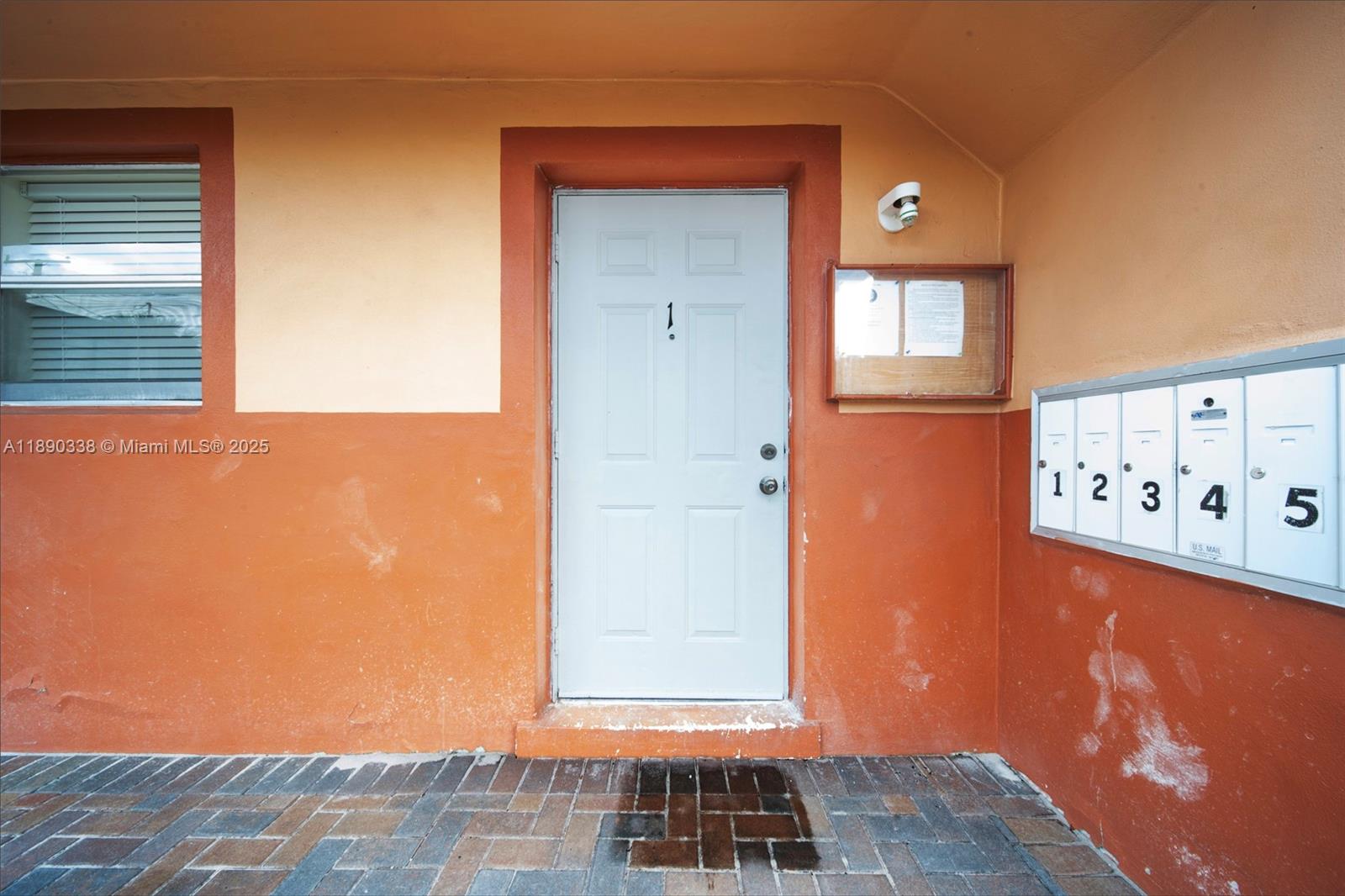 40 West 4th Street, Unit 2 Hialeah, FL 33010 - Photo 18 of 44 a view of a hallway with wooden floor and a window