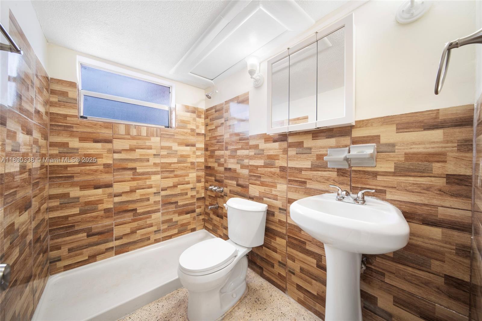 40 West 4th Street, Unit 2 Hialeah, FL 33010 - Photo 24 of 44 a bathroom with a sink toilet and mirror