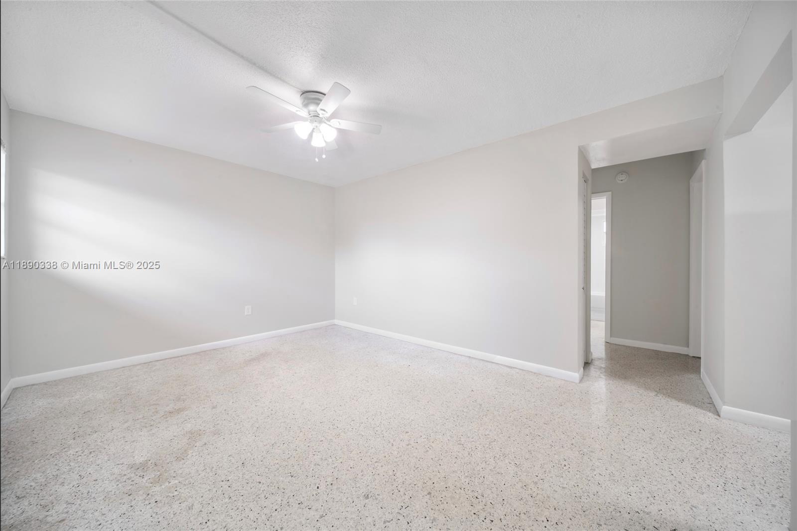 40 West 4th Street, Unit 2 Hialeah, FL 33010 - Photo 26 of 44 an empty room with an entryway and fan