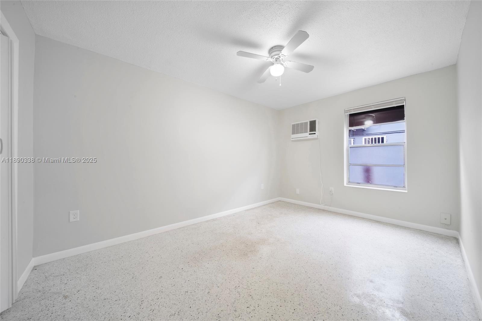 40 West 4th Street, Unit 2 Hialeah, FL 33010 - Photo 31 of 44 an empty room with windows and fan