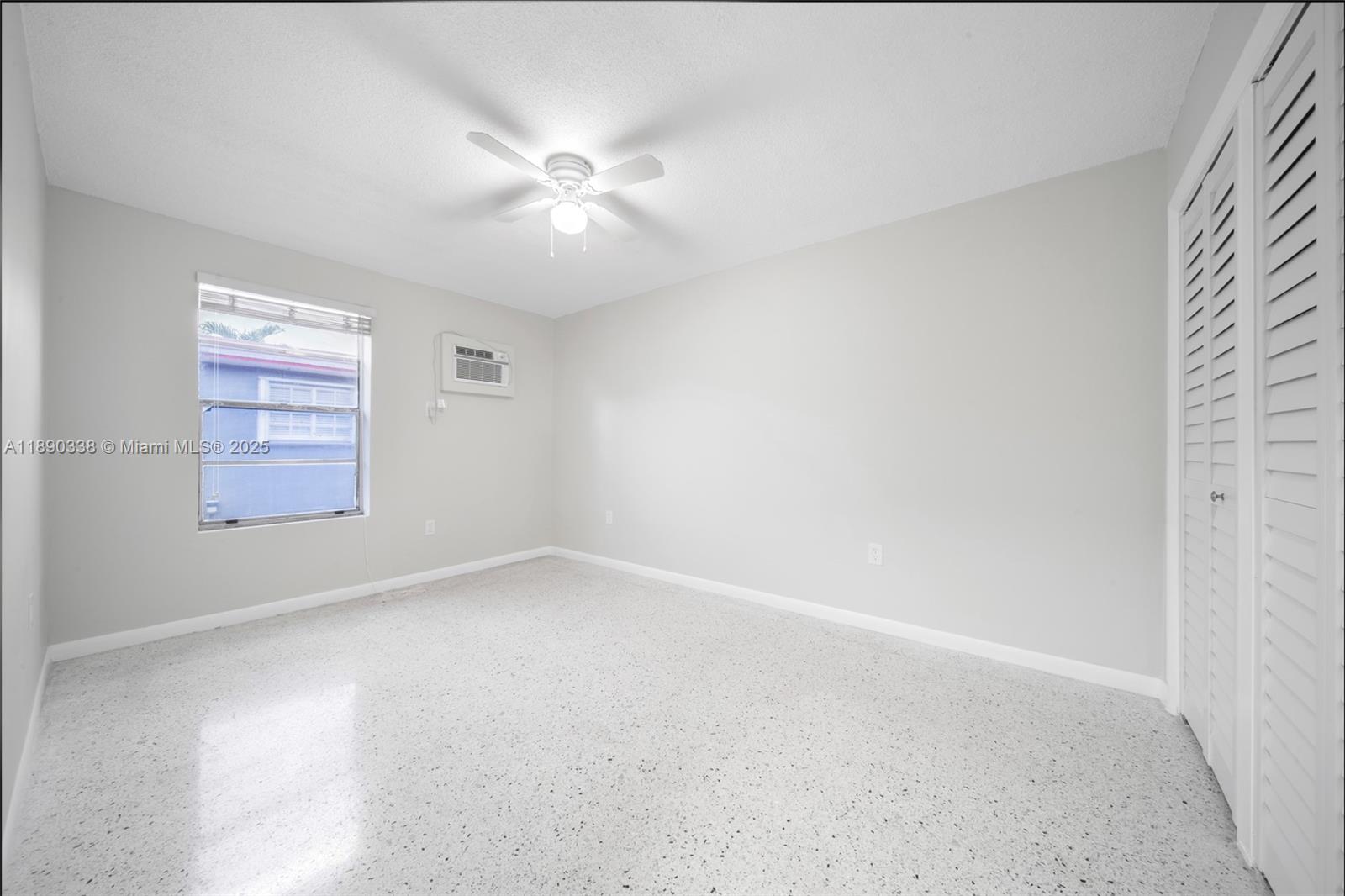 40 West 4th Street, Unit 2 Hialeah, FL 33010 - Photo 42 of 44 an empty room with windows and fan
