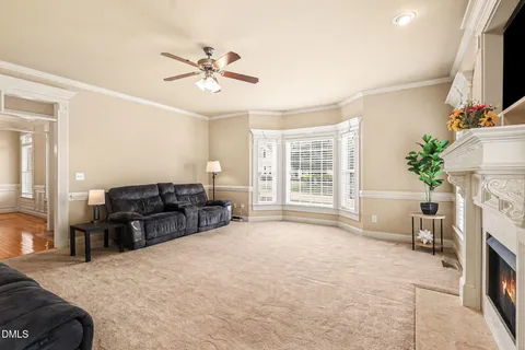 a bed room with furniture and a flat screen tv