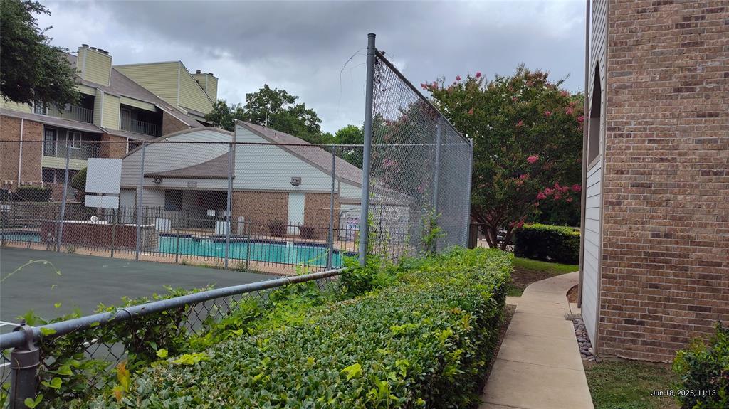 6108 Abrams Road, Unit 522 Dallas, TX 75231 - Photo 13 of 14 View of tennis court featuring a community pool
