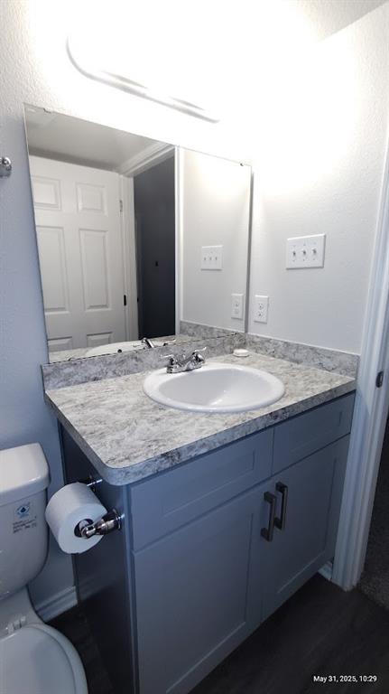 6108 Abrams Road, Unit 522 Dallas, TX 75231 - Photo 9 of 14 Bathroom featuring vanity and toilet