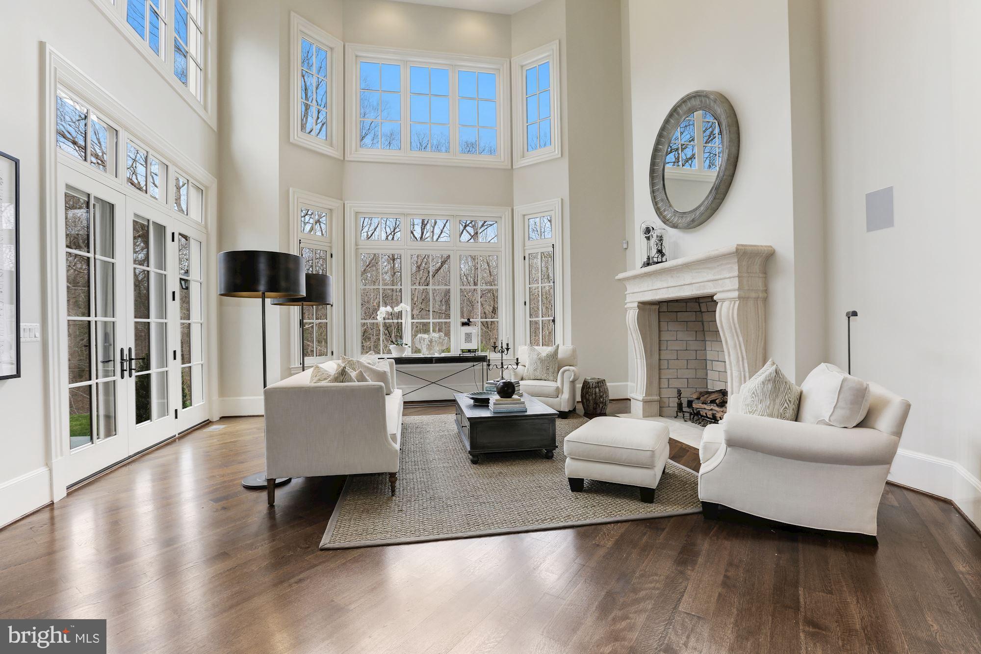 906 Turkey Run Road McLean, VA 22101 - Photo 13 of 52 a living room with fireplace furniture and a large window
