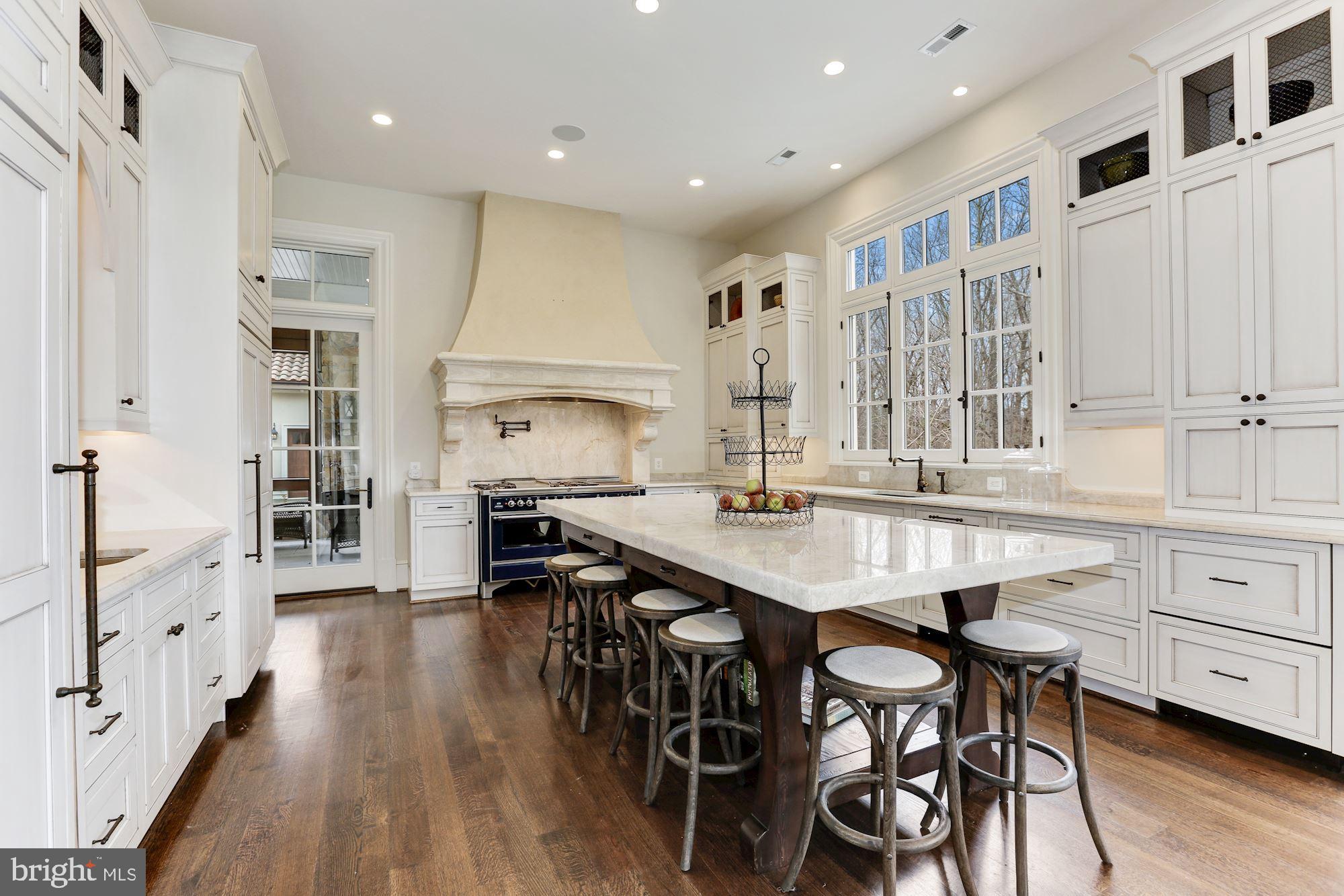 906 Turkey Run Road McLean, VA 22101 - Photo 16 of 52 a open kitchen with stainless steel appliances granite countertop a stove a sink dishwasher and a refrigerator with wooden floor