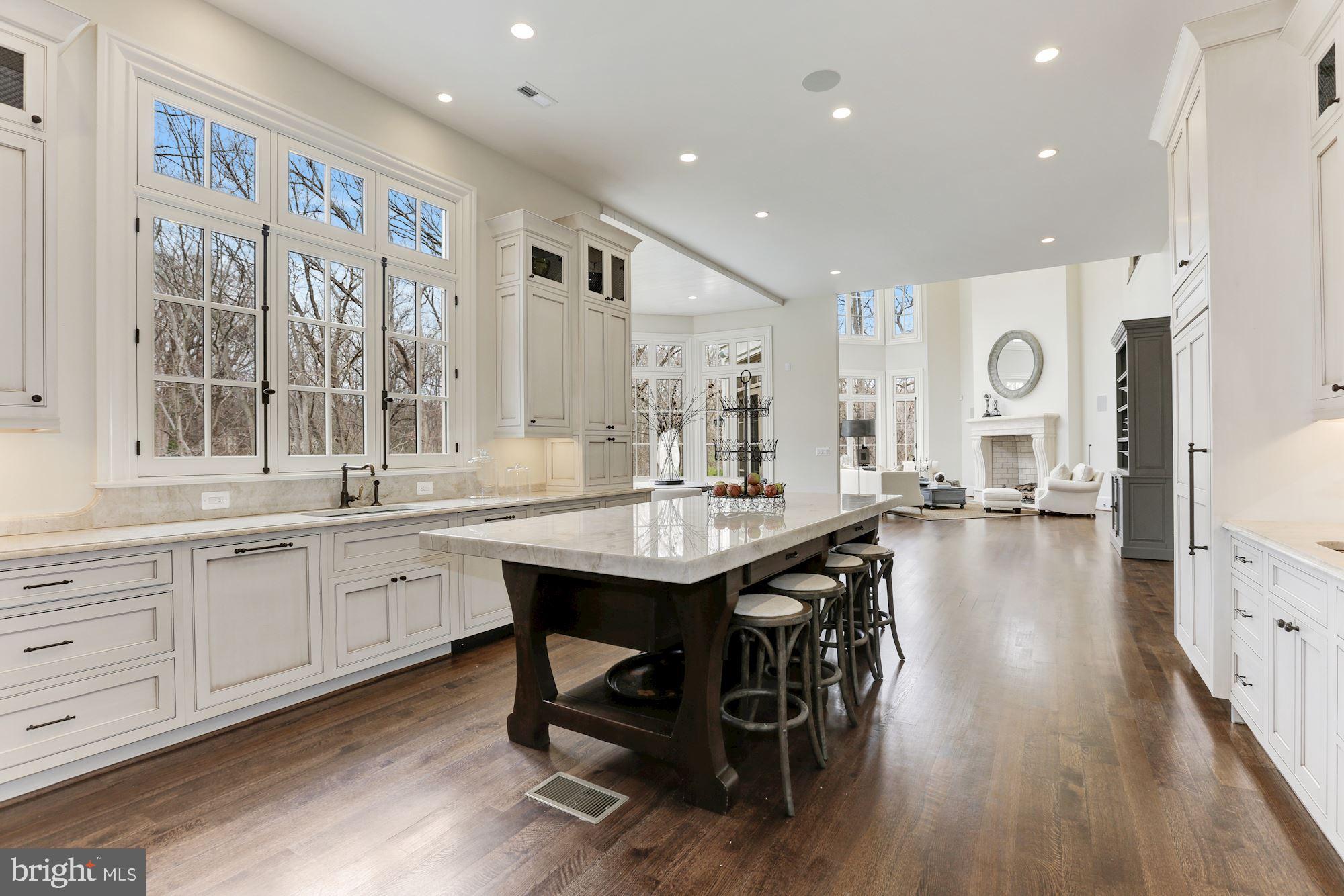 906 Turkey Run Road McLean, VA 22101 - Photo 19 of 52 a open kitchen with stainless steel appliances granite countertop a lot of counter space and wooden floors