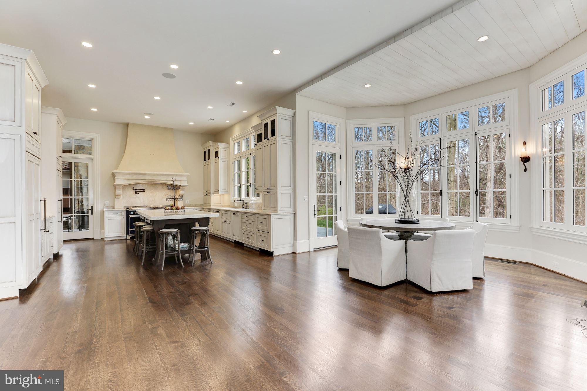 906 Turkey Run Road McLean, VA 22101 - Photo 21 of 52 a living room with couches and kitchen view with wooden floor