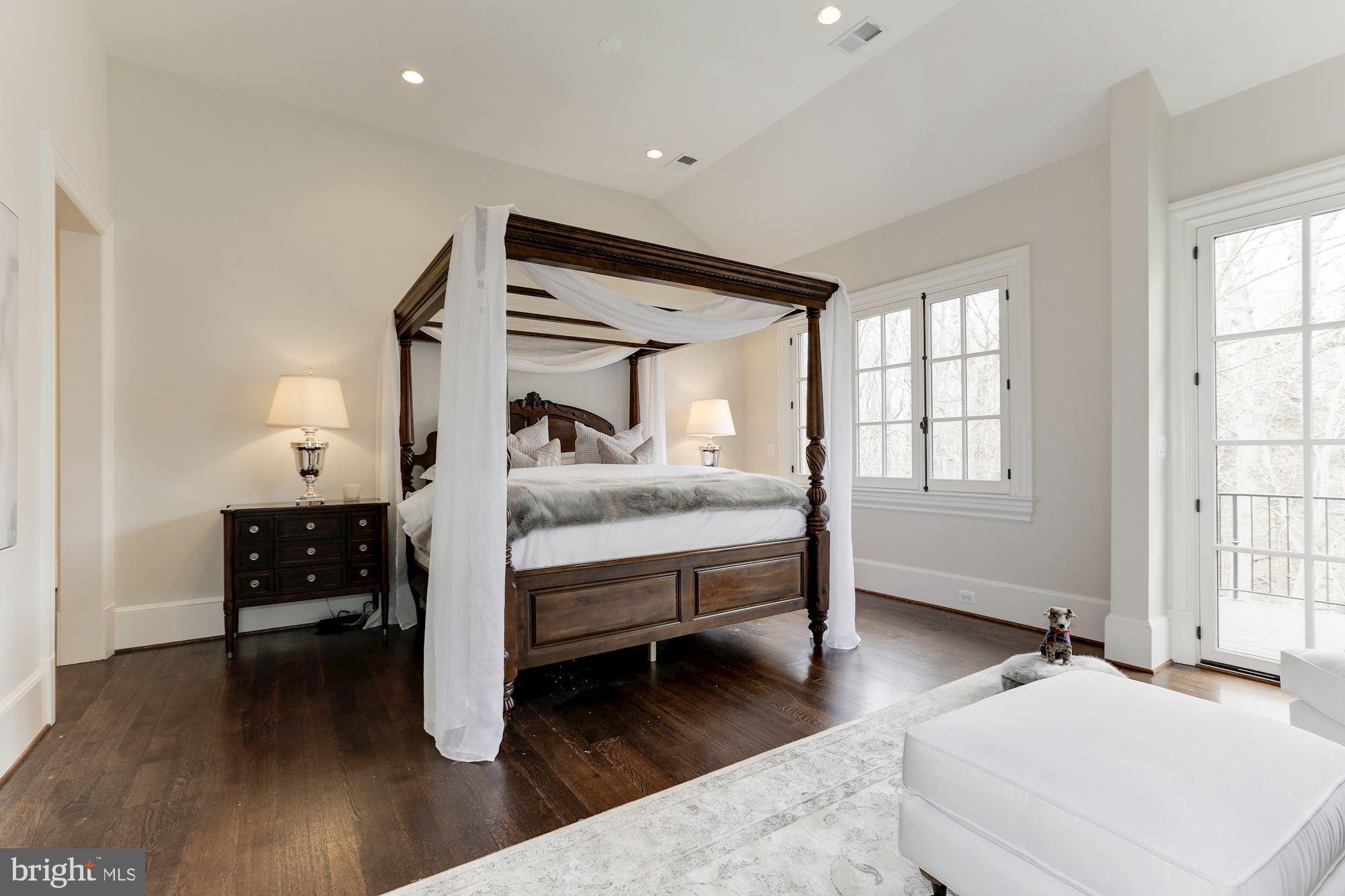 906 Turkey Run Road McLean, VA 22101 - Photo 26 of 52 a spacious bedroom with a bed and a window