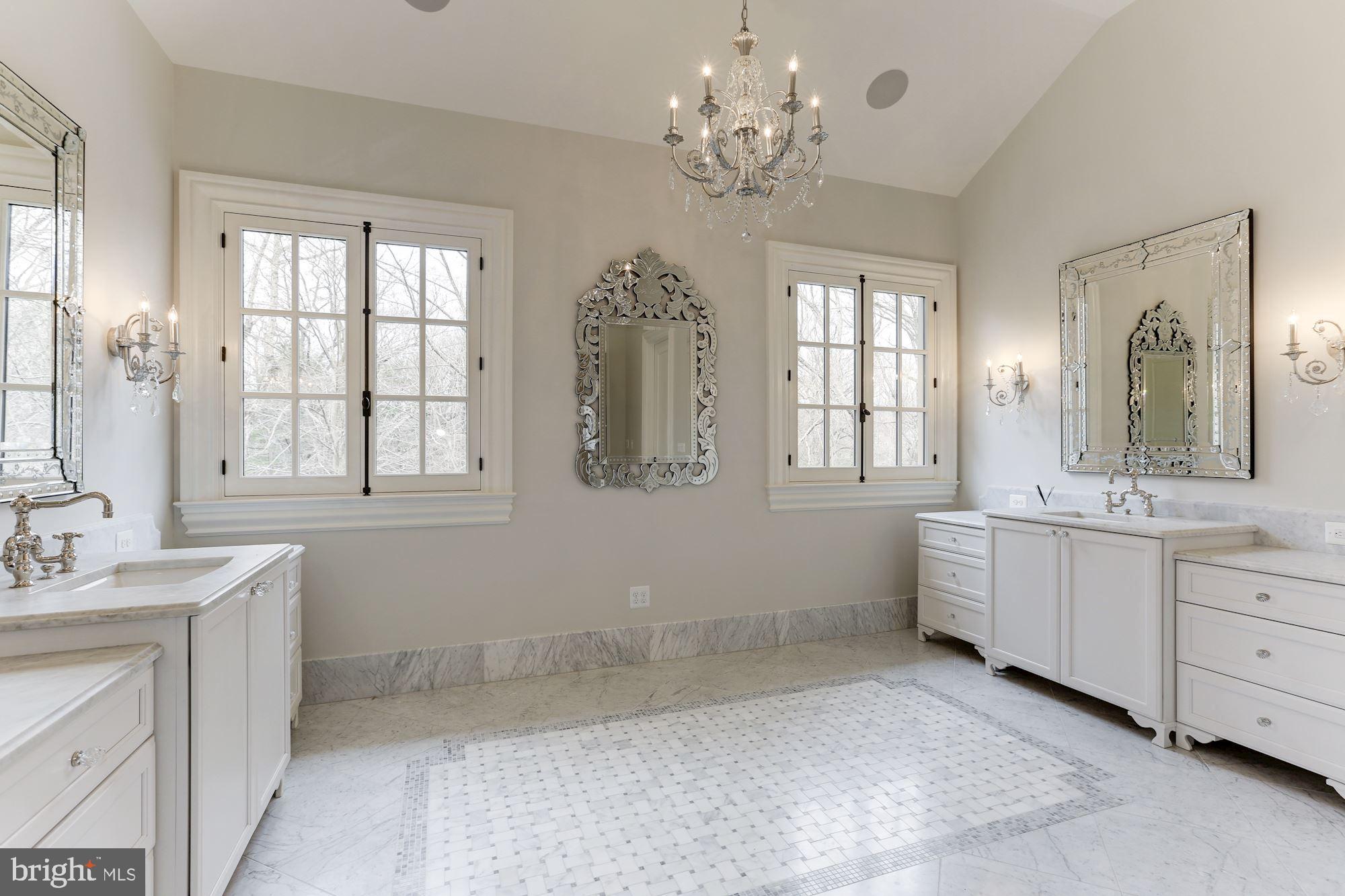 906 Turkey Run Road McLean, VA 22101 - Photo 28 of 52 a large bathroom with a double vanity sink large mirror and a bathtub