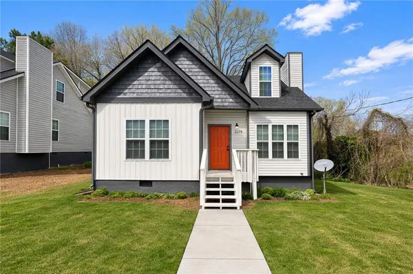 a front view of a house with a yard