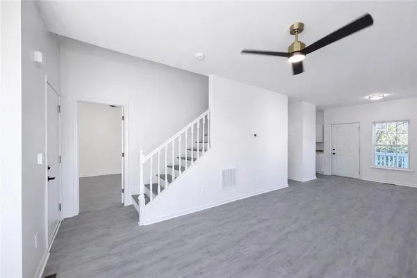 a view of an entryway with wooden floor